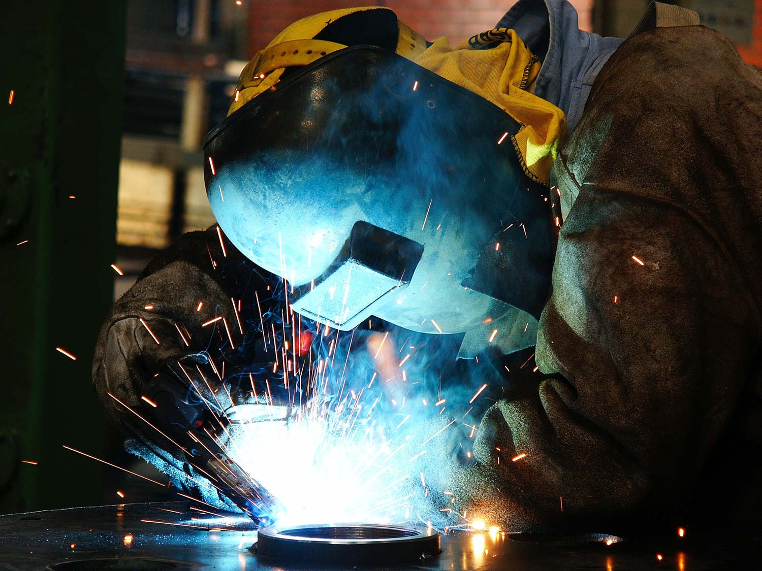 a man is welding in the workshop